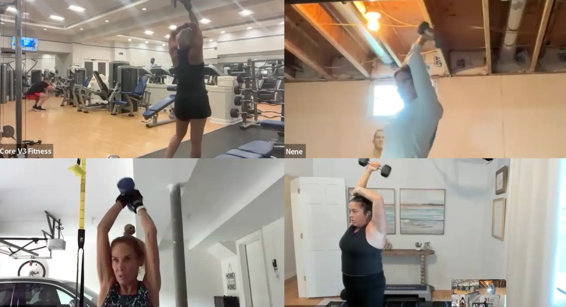 Four Core V3 members lifting dumbbells overhead together on a live Zoom call, from a gym, a basement, a garage, and a living room